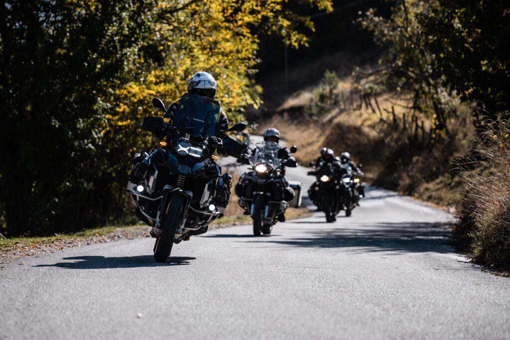 group,of,motorcyclists,riding,their,adventure,motorcycles,on,a,scenic
