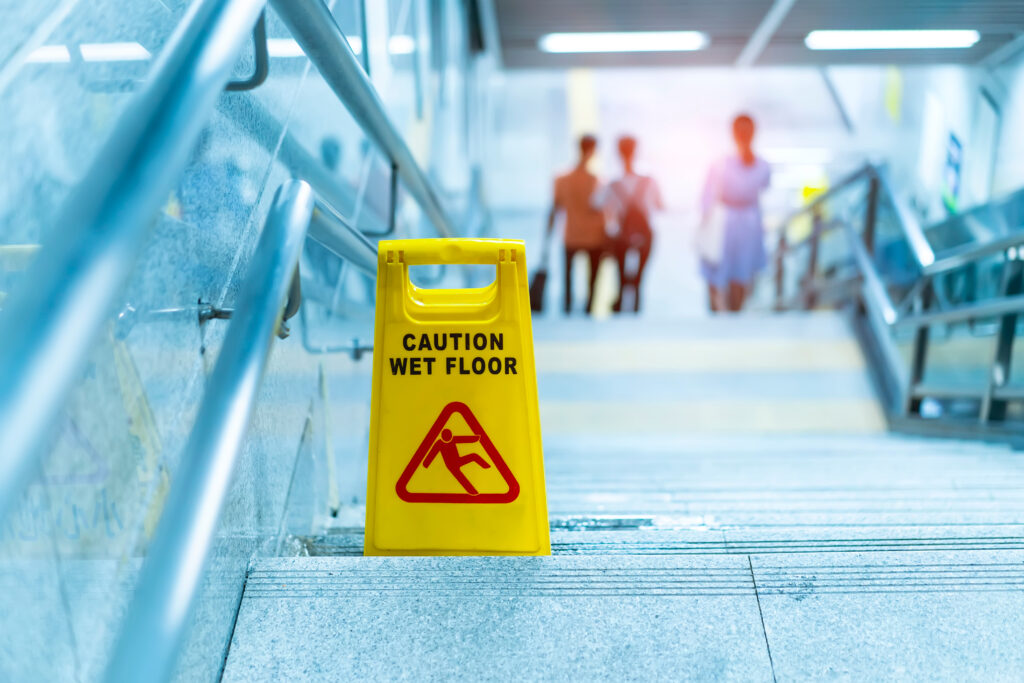 "caution,wet,floor",sign,in,stairs